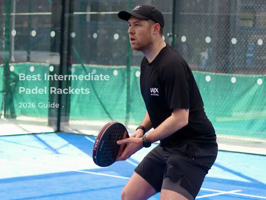 Intermediate padel player preparing for return shot on padel court