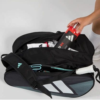Adidas Control 2026 padel racket bag open showing storage compartment with padel balls and gear
