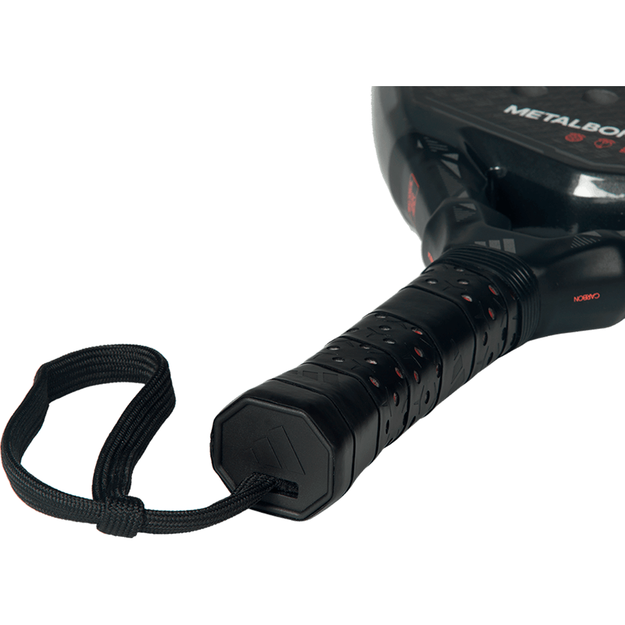 Close-up of the Adidas Metalbone Carbon 2026 handle with black grip and wrist strap, designed for advanced players.