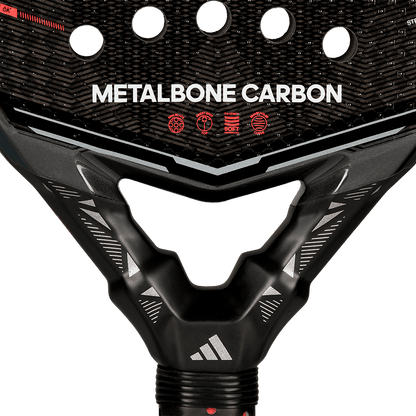 Detail view of the Adidas Metalbone Carbon 2026 neck showing structural frame and carbon texture, designed for advanced players.