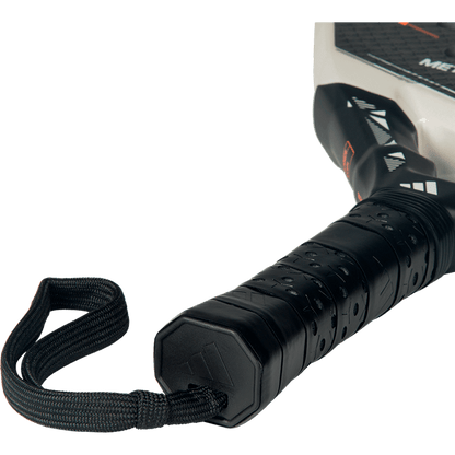 Close-up of the Adidas Metalbone Carbon CTRL 2026 handle with black grip and wrist strap, designed for advanced players.