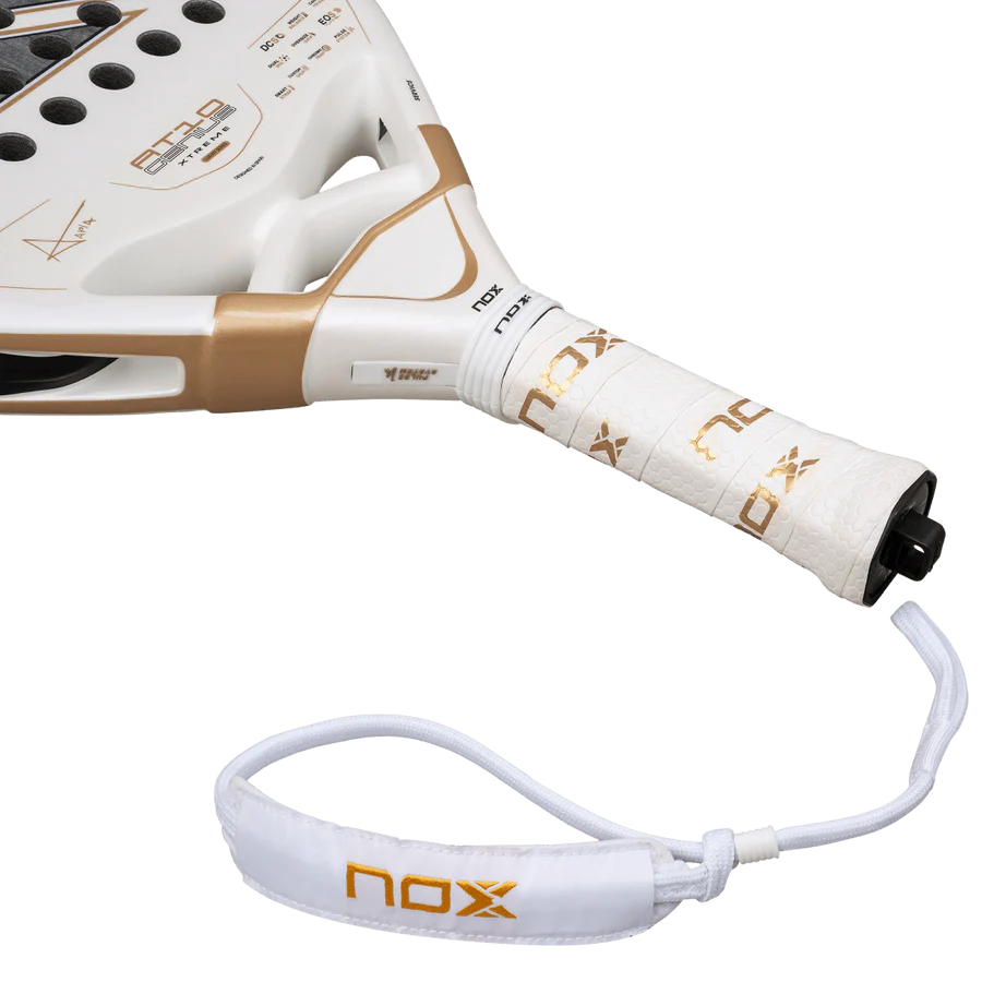 NOX AT10 Luxury Genius 12K Alum XTREM 2026 padel racket handle close-up with white grip and strap, designed for advanced players.