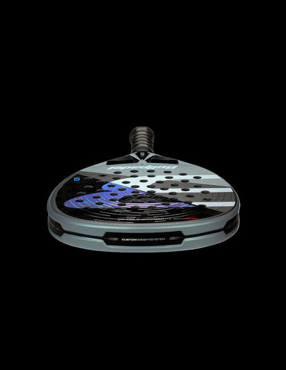 Low angle surface view of the Bullpadel Hack 04 26 showing the carbon face texture and custom weight system, designed for advanced players.