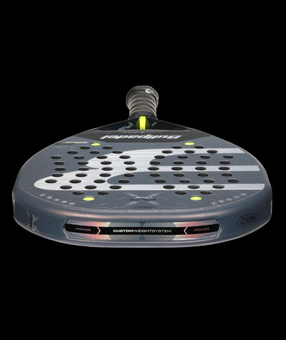 Bullpadel Xplo Comfort 26 padel tennis racket for advanced players, black and grey design with white B logo, low angle view.