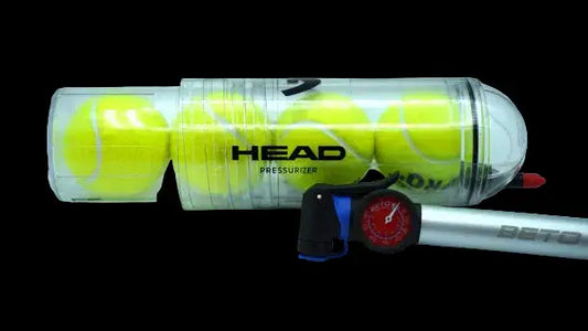 HEAD X4 ball pressuriser and pump laid horizontally with transparent tube for restoring padel and tennis ball pressure