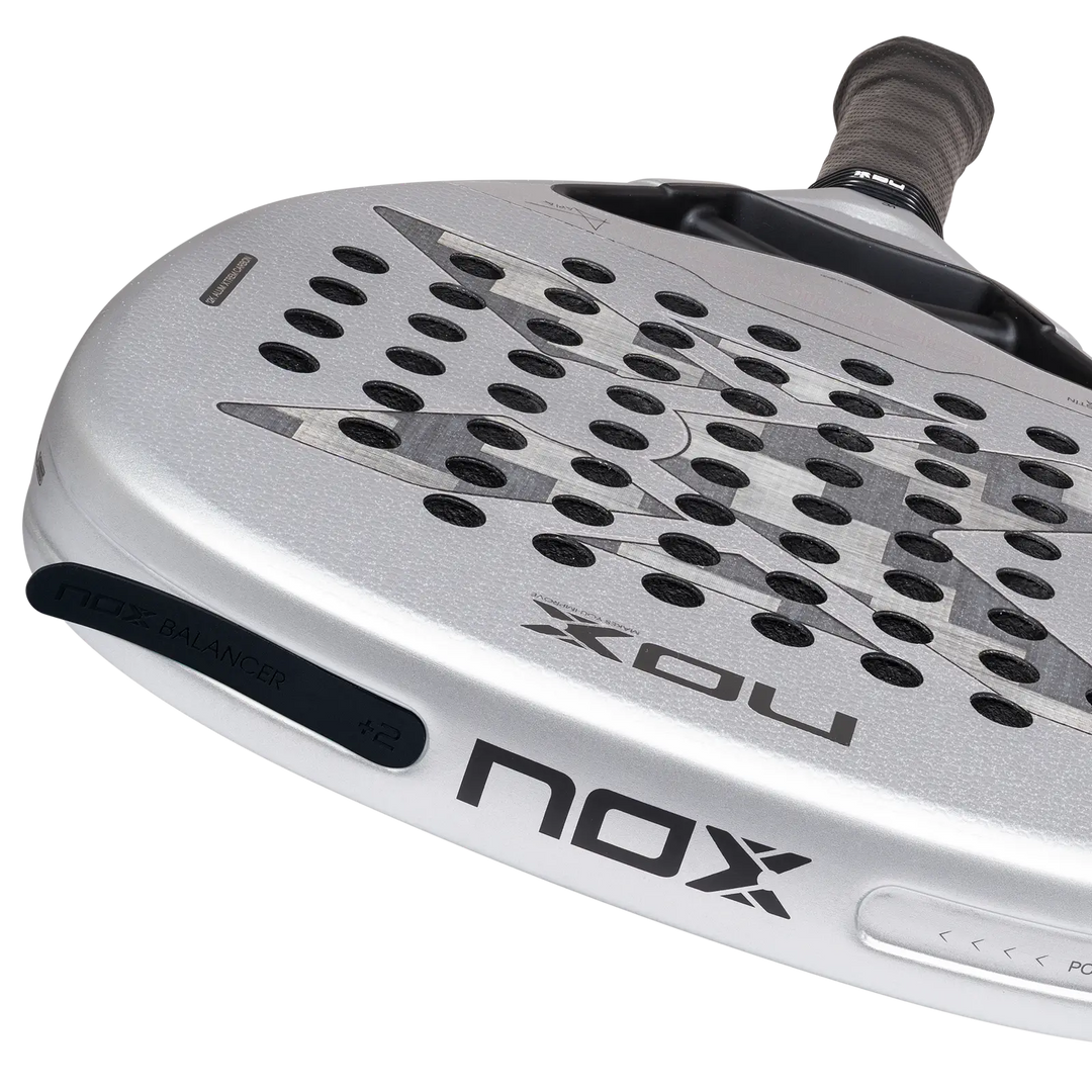 Close-up of the NOX AT10 Genius Attack 12K Alum XTREM 2027 racket face with NOX Balancer weights