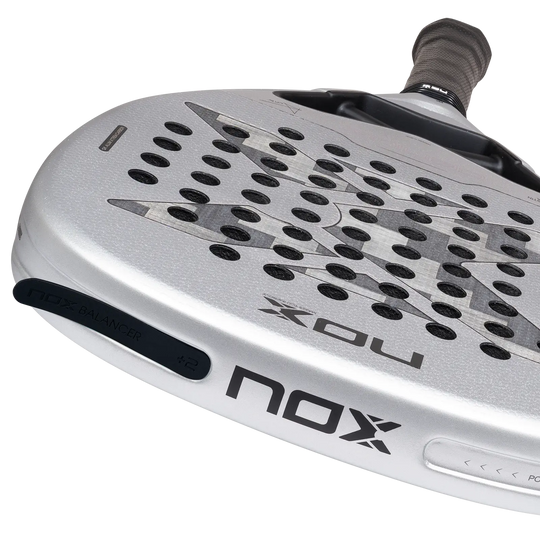 Close-up of the NOX AT10 Genius Attack 12K Alum XTREM 2027 racket face with NOX Balancer weights