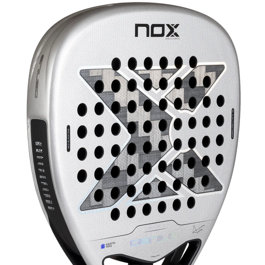 Close-up of the NOX AT10 Genius Attack 12K Alum XTREM 2027 silver racket face showing its carbon pattern and drill holes