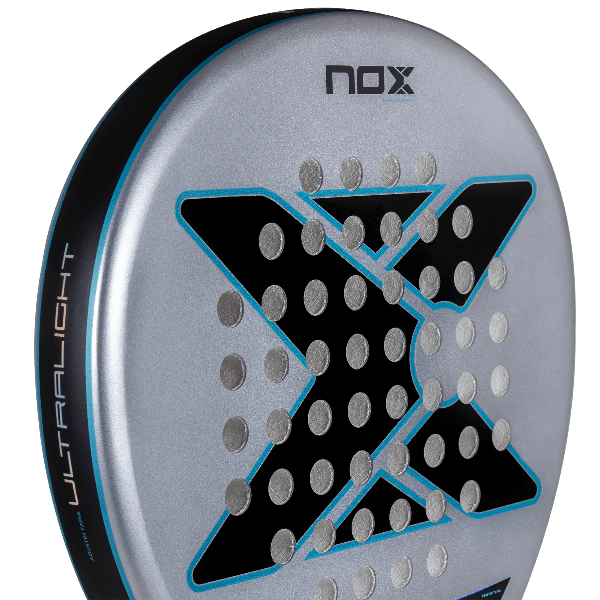 Close up of Nox AT10 Genius Ultralight padel racket face highlighting lightweight materials and hole pattern, designed for beginner players