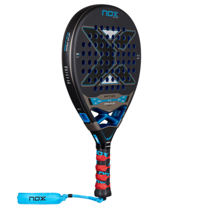Nox AT10 Pro Cup Soft 2026 padel racket full view with red overgrip and wrist strap, designed for advanced players