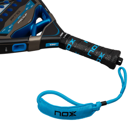 Nox AT10 Pro Cup Soft 2026 padel racket handle close up showing grip texture and wrist strap, designed for advanced players