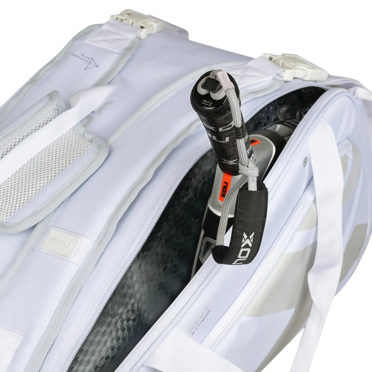 Nox AT10 Team white padel bag open racket compartment showing thermo lining and racket storage, designed for all level players`