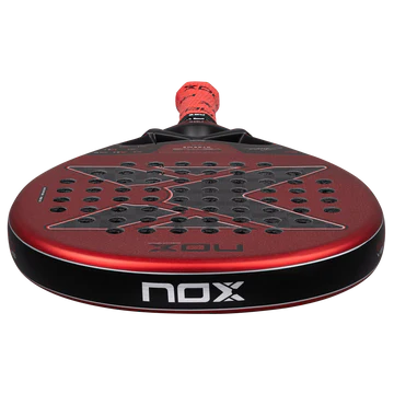 Nox EA10 Ventus Hybrid 12K Xtrem 2026 padel tennis racket for advanced players, low close-up angle with red edge and NOX branding on transparent background.
