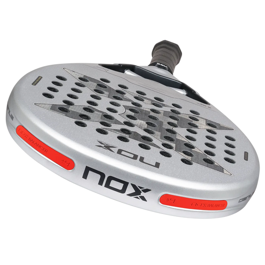 NOX Genius 12K Alum XTREM 2027 padel racket showing silver carbon face and red NOX Balancer +4 weight inserts