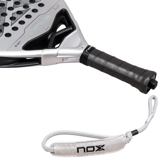 Close-up of NOX Genius 12K Alum XTREM 2027 showing black grip, white Smart Strap and silver racket throat