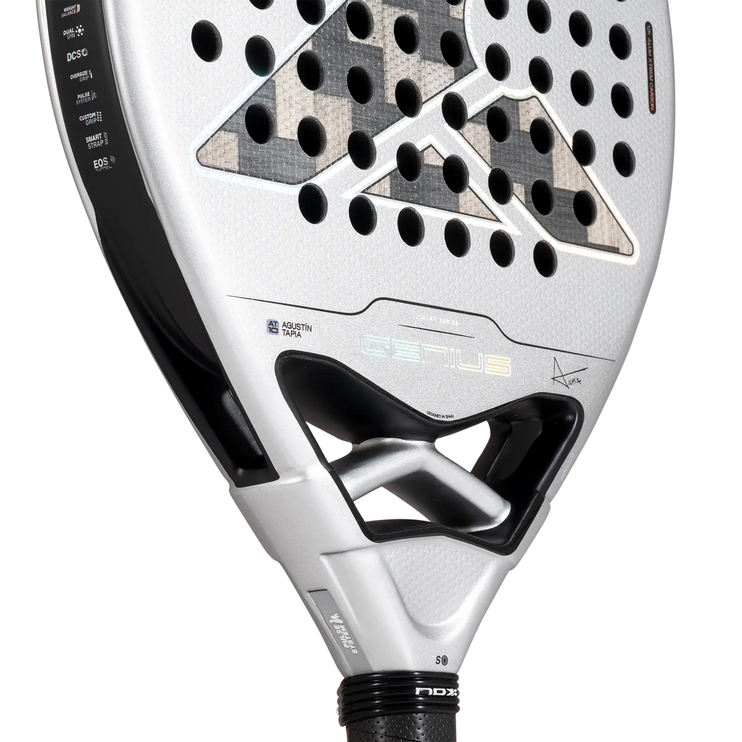 Close-up of NOX Genius 12K Alum XTREM 2027 padel racket showing Agustín Tapia branding and reinforced throat design