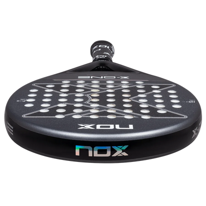Nox X-One 2026 padel racket low front edge view showing frame thickness and face surface, designed for beginner players