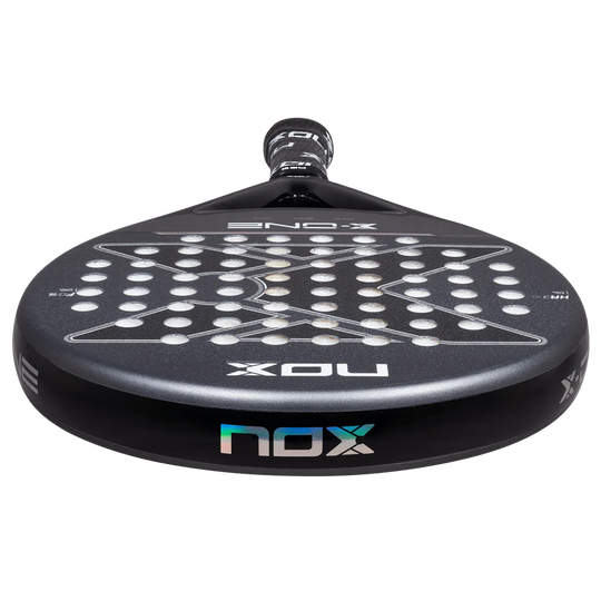 Nox X-One 2026 padel racket low front edge view showing frame thickness and face surface, designed for beginner players