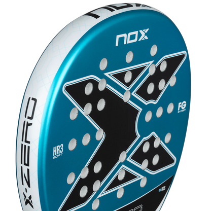 Nox X-Zero Blue 26 padel tennis racket for beginners, close-up side detail showing blue X graphic and NOX logo on transparent background
