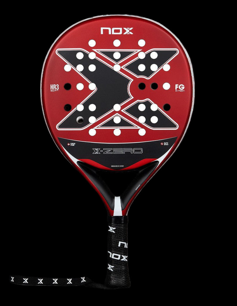 Front view of the Nox X-Zero Red 26 padel racket in red and black with white hole pattern and X-shaped design, designed for beginner players.