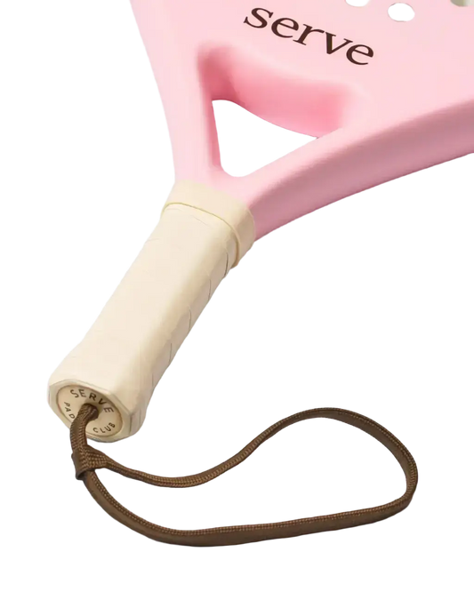 Serve womens padel racket handle close up showing grip and wrist strap detail, designed for women players