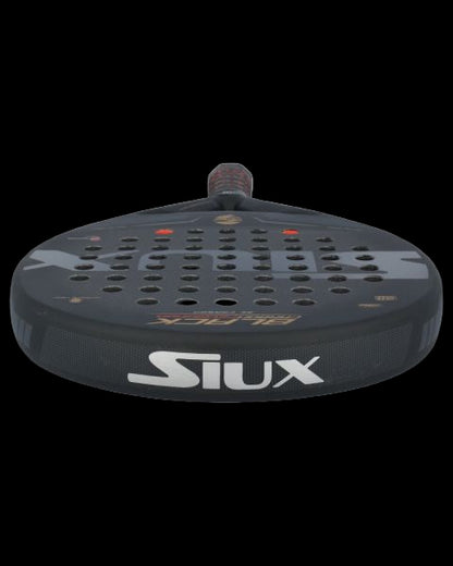 Siux black carbon revolution 3k padel racket low angle view showing full hitting surface.