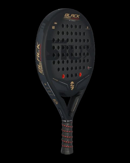 Siux black carbon revolution 3k padel racket angled view showing hole pattern and carbon finish designed.