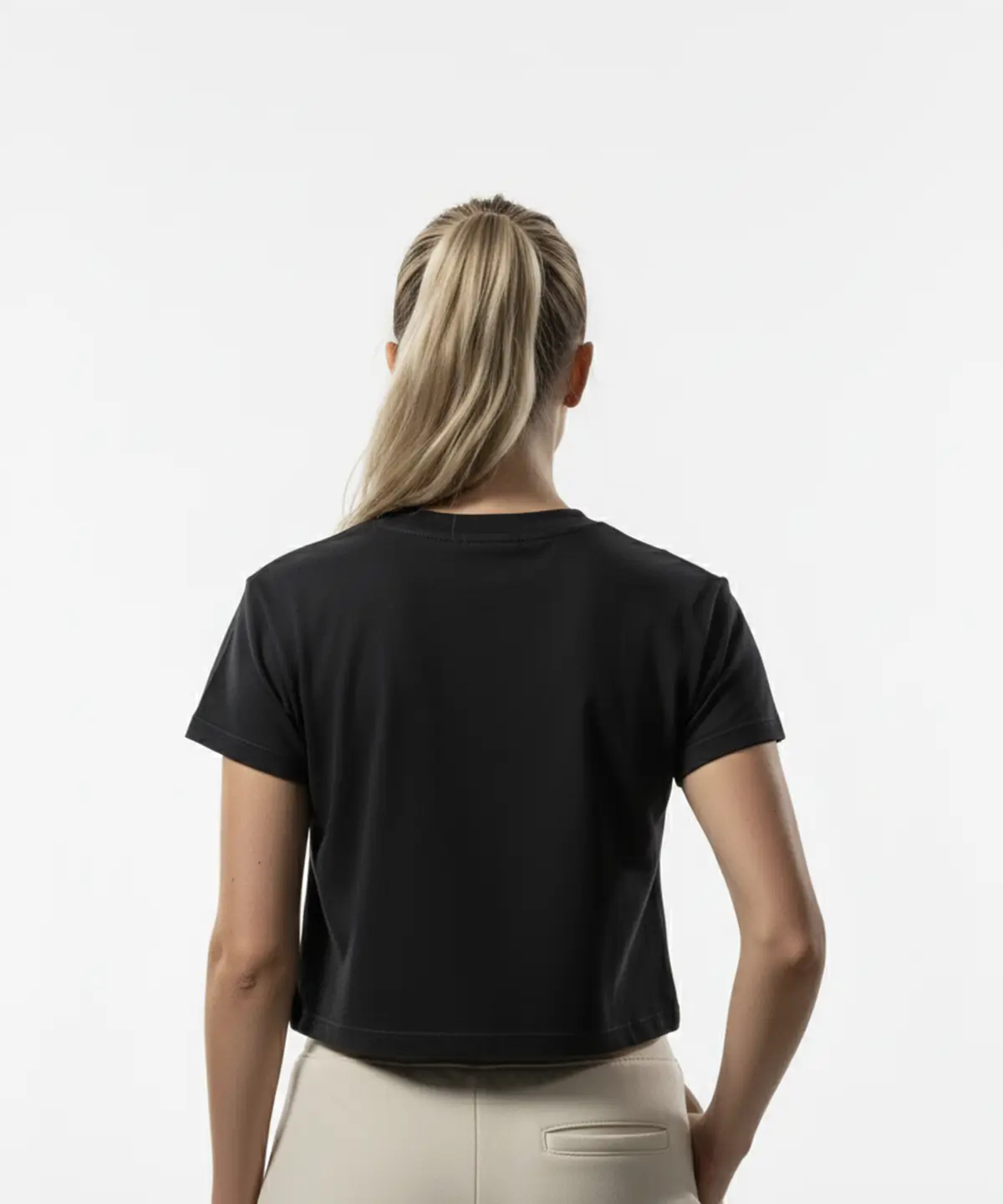 model wearing Third Shot women’s cropped cotton tee in black back view showing short sleeve cut, designed for all level players