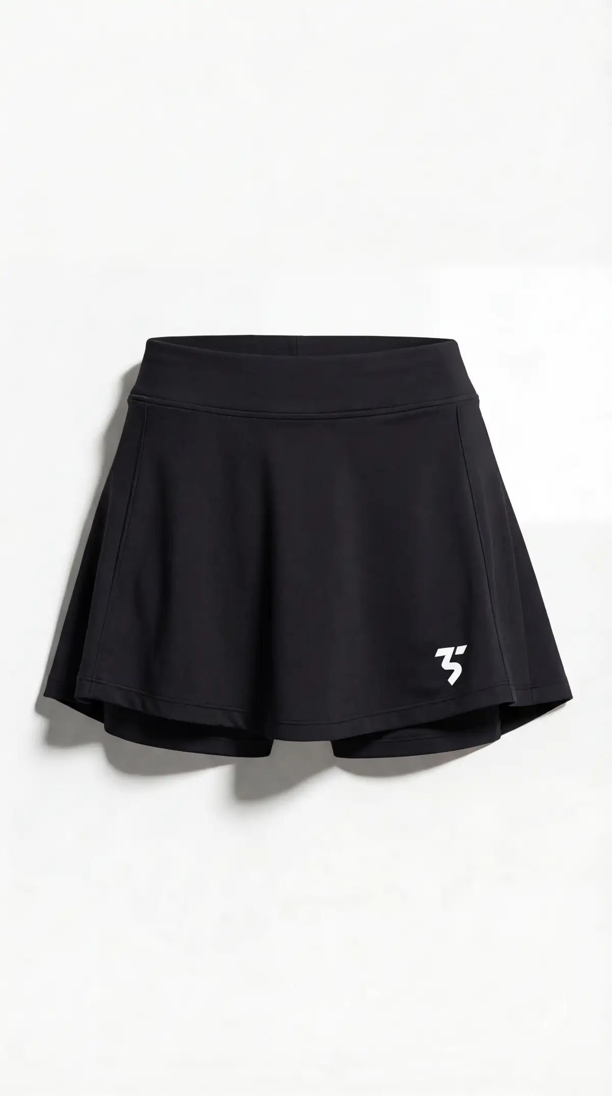 Third Shot women’s performance skort in black front view with integrated shorts, designed for all level players