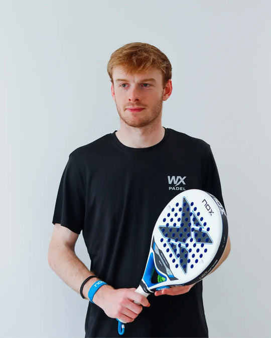 Male player wearing the WX Padel Men’s Performance T-Shirt in black