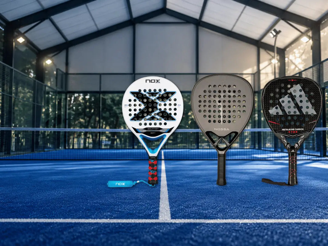 three padel rackets on court, from Nox, Nossa and Adidas.