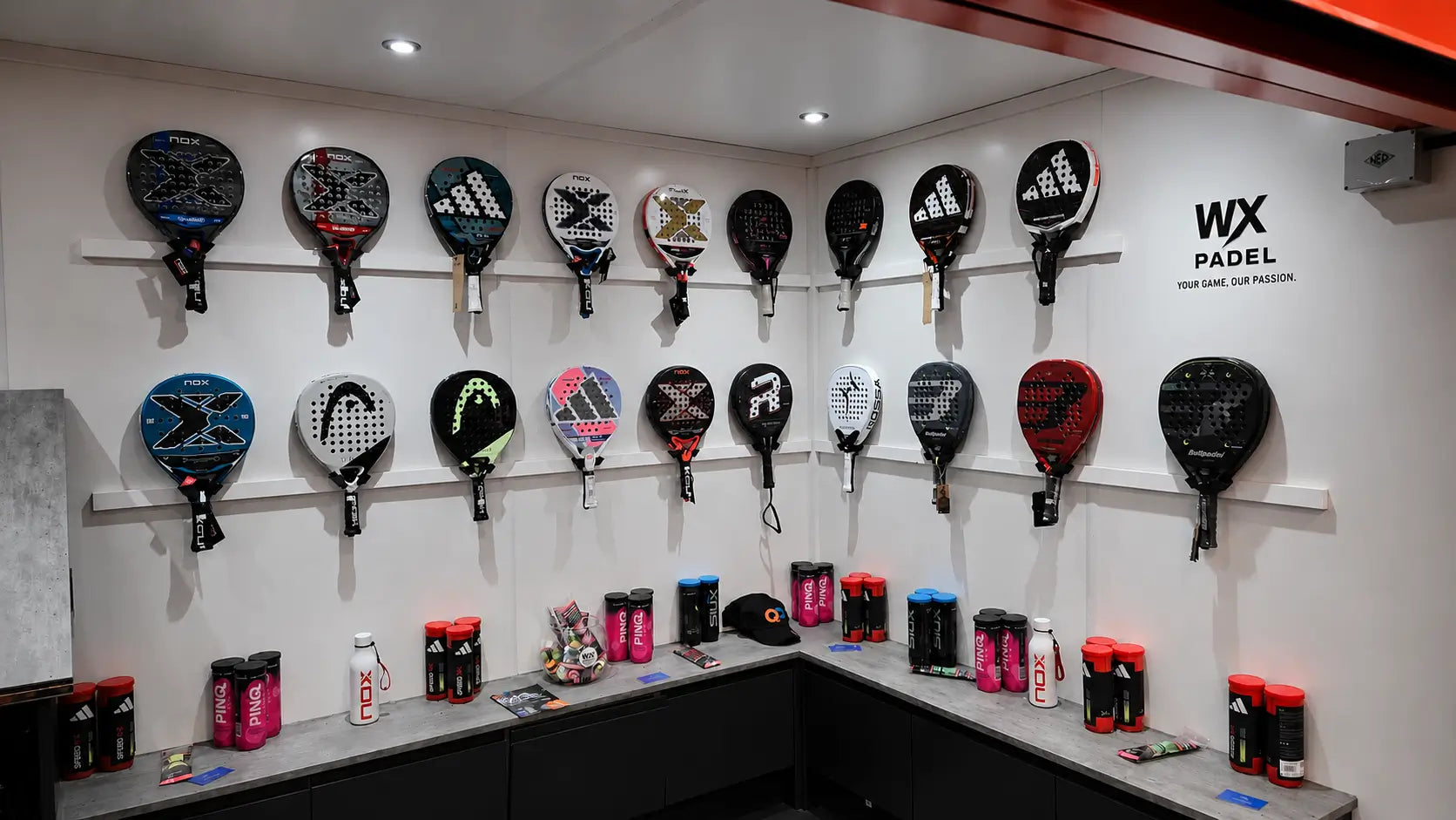 WX Padel showroom display featuring padel rackets and accessories in a specialist UK padel store