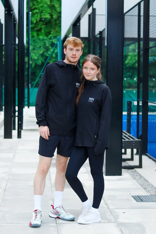 Male and female players wearing black WX Padel Technical Full-Zip Hoodies